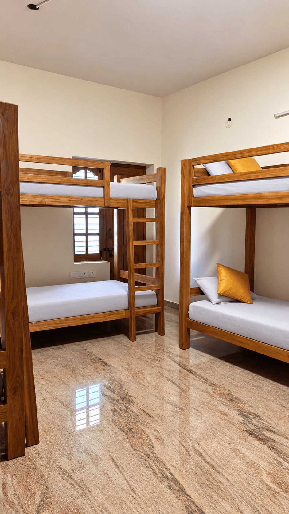 Male-only dorm with wooden bunk beds